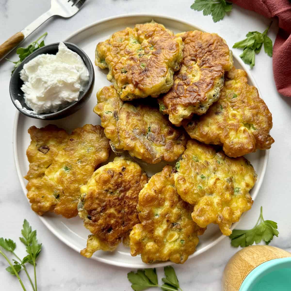 Sweetcorn fritters on white plate