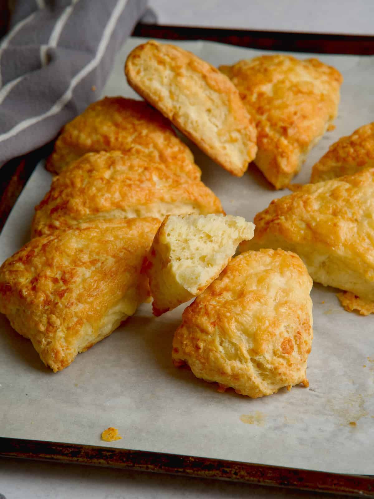 Cheese scones on a baking tray.